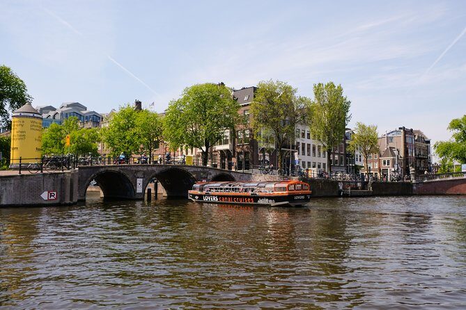 Amsterdam 1h Canal Cruise by Semi-Open Boat with Audio Guide - Who Should Consider This Tour?