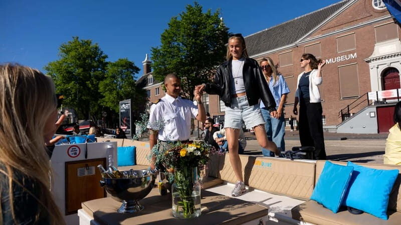 Amsterdam: Canal Cruise in Open Boat with Drink Option - The Atmosphere and Commentary