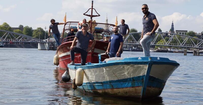 Amsterdam: Canal Cruise on a Wooden Refugee Boat - Key Points