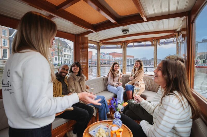 Amsterdam: Canal Cruise with Bubbles & Bites - Key Points