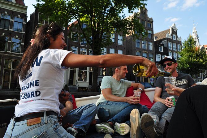 Amsterdam Canal Cruise With Live Guide and Unlimited Drinks - Authentic Experiences and Insider Tips