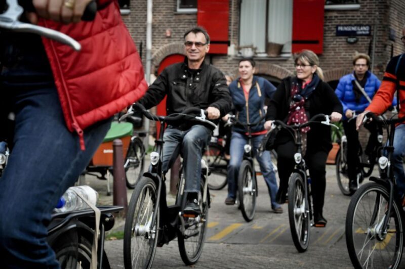 Amsterdam: Guided City Bike Tour in French - Key Points