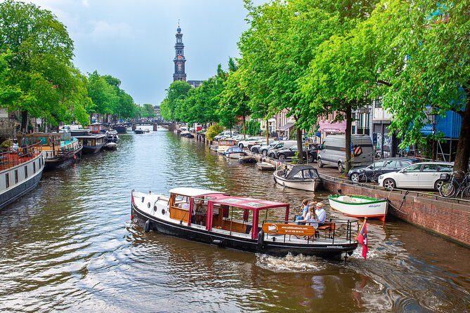 Amsterdam Small-Group Canal Cruise With Dutch Snacks and Drink - The Experience Onboard: Food, Drinks, and Atmosphere