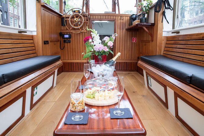 Amsterdam Small-Group Canal Cruise With Dutch Snacks and Drink - Practical Aspects: Logistics, Price, and Accessibility