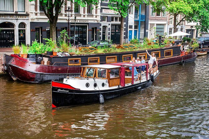 Amsterdam Small-Group Canal Cruise With Dutch Snacks and Drink - Authenticity and Guides