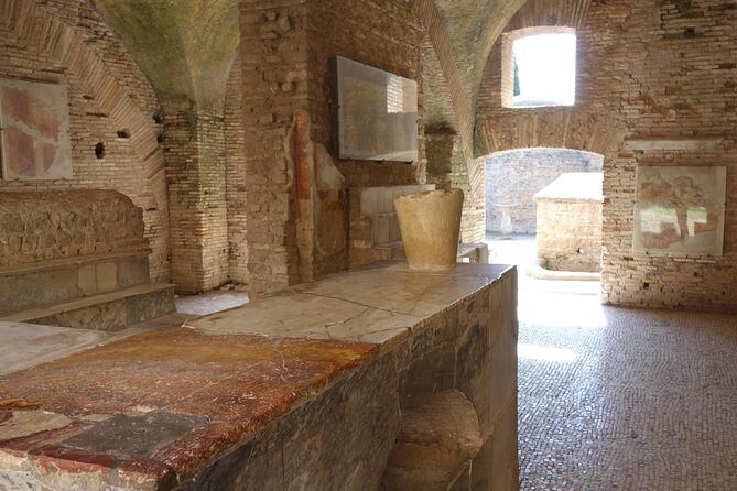 Ancient Ostia Antica Semi-Private Day Trip from Rome by Train with Guide - Deep Dive into the Ruins