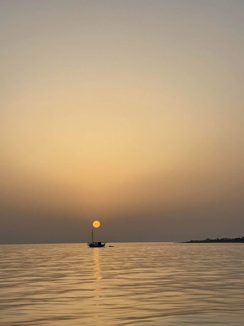 Argostoli: Sunset Cruise with Swim Stops, Dinner, and Wine - Key Points