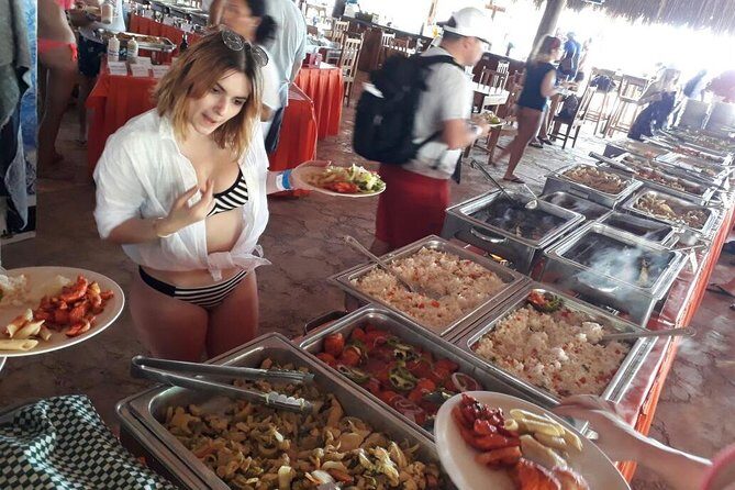 Catamaran Adventure Tour Isla Mujeres Unlimited from Cancun with Transportation - Beach Club and Relaxation