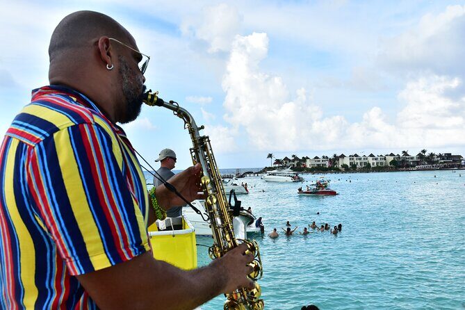 Catamaran Adventure Tour Isla Mujeres Unlimited from Cancun with Transportation - Party Vibes on the Return Trip
