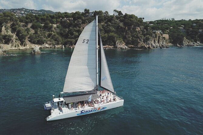 Catamaran departure in a young atmosphere - An In-Depth Look at the Costa Brava Catamaran Cruise