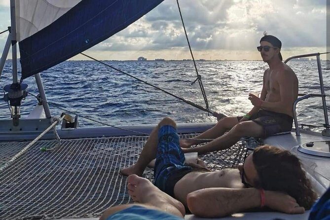 Catamaran Sailing through Caribbean Sea to Isla mujeres - Sunset Sail and Return Journey