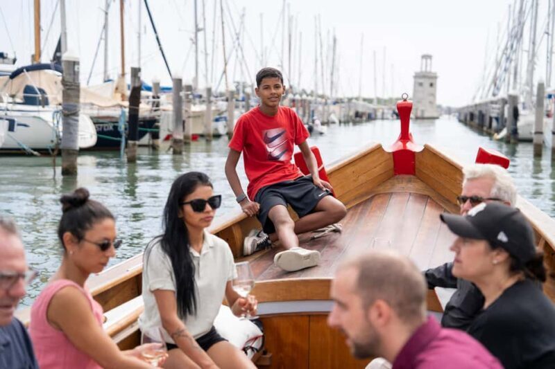 Check out Venice from a different angle: a scenic tour on a traditional boat. - An Authentic Venetian Waterway Voyage