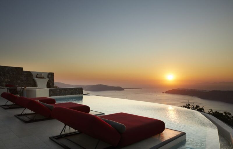 Daybed Relaxation with infinity pool use with caldera views - An In-Depth Look at the Experience