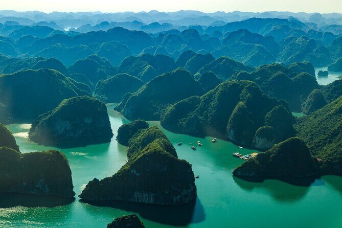 Deluxe Group - Halong Bay Full Day Tour From Hanoi Including Lunch - Visiting the Majestic Grottoes: Nature’s Hidden Artworks