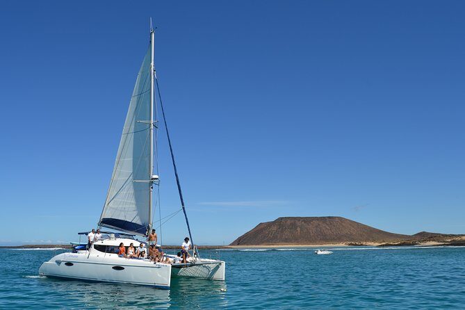 Exclusive Sailing Catamaran Experience to Lobos Island with lunch and drinks - Who Should Consider This Tour?