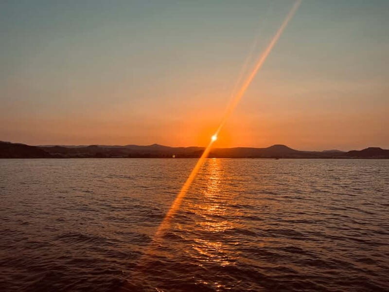 Faliraki: Sunset Cruise with Unlimited Aperol, Beers & Wine - Drinks and Music: Unwind in Style