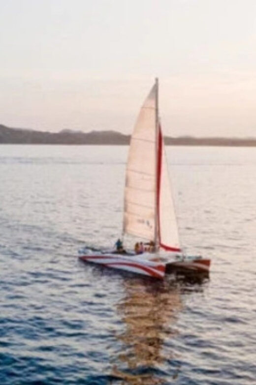 Fornells: Catamaran Sunset Cruise of Menorca's Coast - Key Points