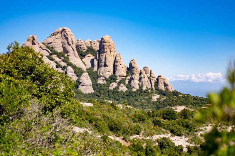 From Barcelona: Montserrat Monastery, Easy Hike, Cable Car - Montserrat Monastery and Cloister