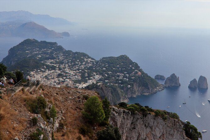 From Capri Guided Tour with Faraglioni and Grottoes Visit - Key Points: