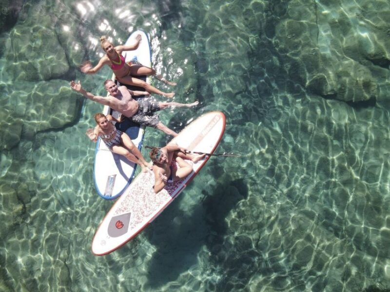 From Ornos: Mykonos Delos Catamaran Cruise with Meal & SUP - The Sum Up