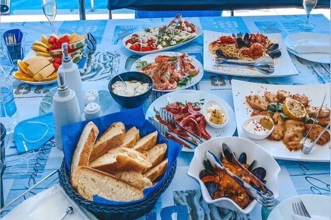 Half-Day Exclusive Catamaran Cruise in Santorini with Meal and Open Bar - Frequently Asked Questions