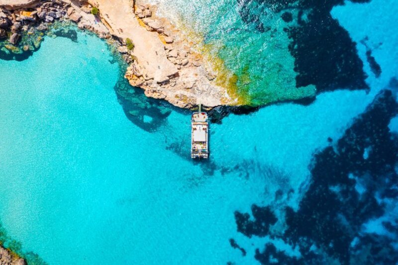 Ibiza: Beach Hopping Cruise w/ Paddleboard, Food, & Drinks - Key Points