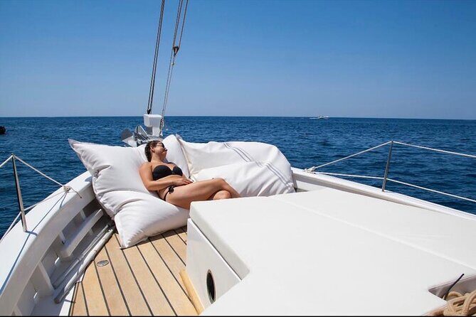 Ibiza: Private Sailboat with Tapas, Open Bar & Music - The Stop at Cala Bassa and Coastal Highlights