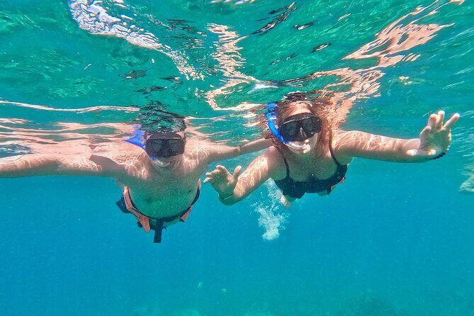 Isla Mujeres Catamaran Tour with Open Bar from Costa Mujeres - The Sum Up