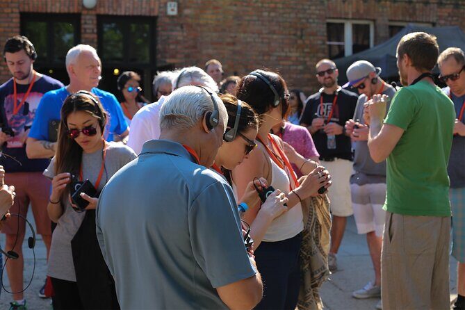 Krakow: Auschwitz Guided Tour Hotel Pickup & Lunch Option - The Guide and Visitor Experience