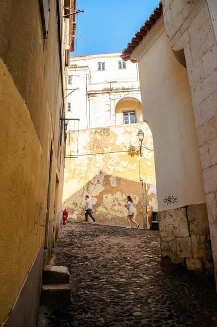 Lisbon: Alfama, Mouraria Walking Tour with Fado Night, Tapas - Key Points