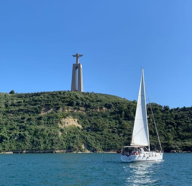 Lisbon: Private Sunset Sailboat Tour with Welcome Drink - The Sum Up