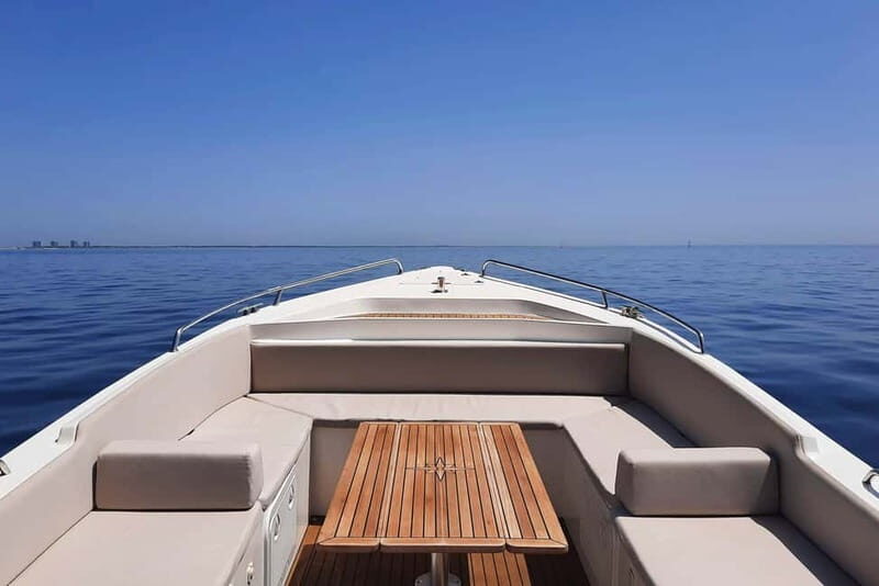 Lisbon Sunset Boat Tour with local Snacks & Drinks - The Sum Up