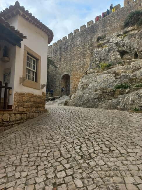 Lisbon: Transfer to Porto with Obidos and Nazare - Key Points