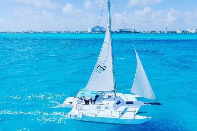 Luxury Catamaran to Isla Mujeres, Snorkeling, Buffet and Ice Bar - First Stop: Snorkeling at Arrecife El Meco