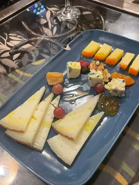 Madrid: Tapas & Wine Tour with Visit to a Rooftop - Authentic Experiences and Unique Details