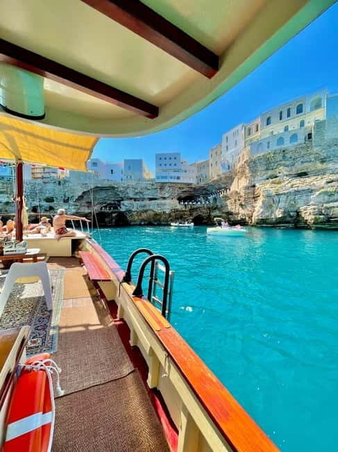 Monopoli-Polignano: sunset boat tour on a traditional wooden boat - Key Points