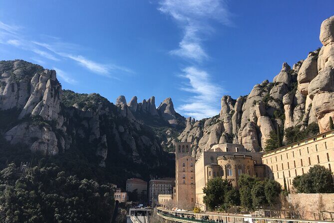 Montserrat Land of Shrines - One Day Small Group Hiking Tour from Barcelona - Visiting the Benedictine Abbey and the Black Madonna