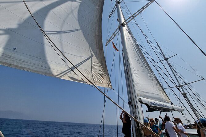 Mykonos Sail Cruise to Rhenia, Guided Tour of Delos, Lunch&Drinks - The Sum Up