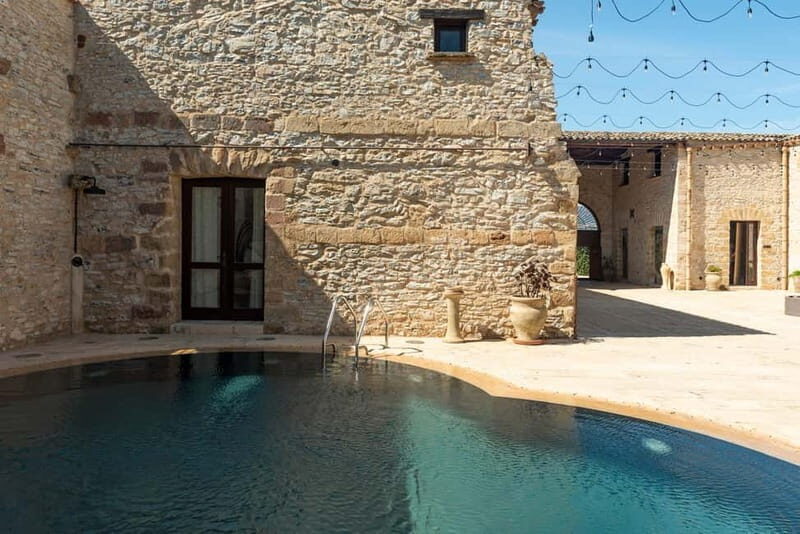 Nature and relaxation by the pool at Baglio Passofondo Estates - The Day at the Pool: How it Unfolds