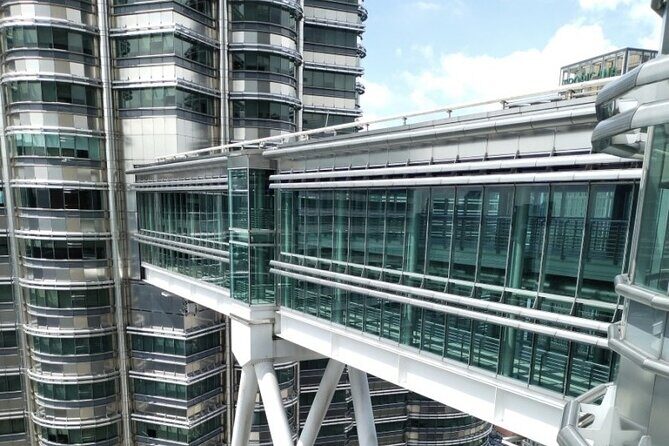 Petronas Twin Tower Skybridge View & Dining Experience Tour with Local Host - Detailed Breakdown of the Itinerary