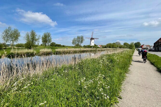 Private Bruges Countryside Cycling Tour to Damme with Guided Walk - Key Points