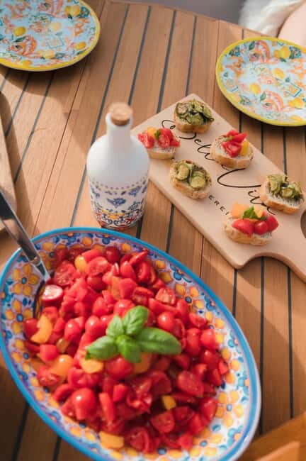 Procida: Complete boat tour of the island with swimming stops and snacks - Key Points