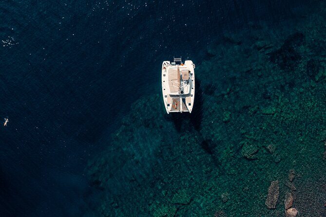 Romantic Sunset Catamaran Caldera Cruise incl. Meal & Drinks - Stops at White Beach & Red Beach