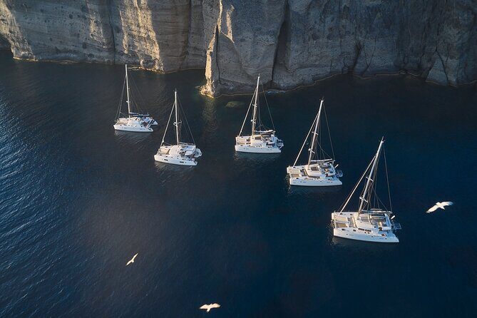 Santorini: Caldera Luxury Catamaran Cruise with Meal & Drinks - Transition to White Beach and Mesa Pigadia