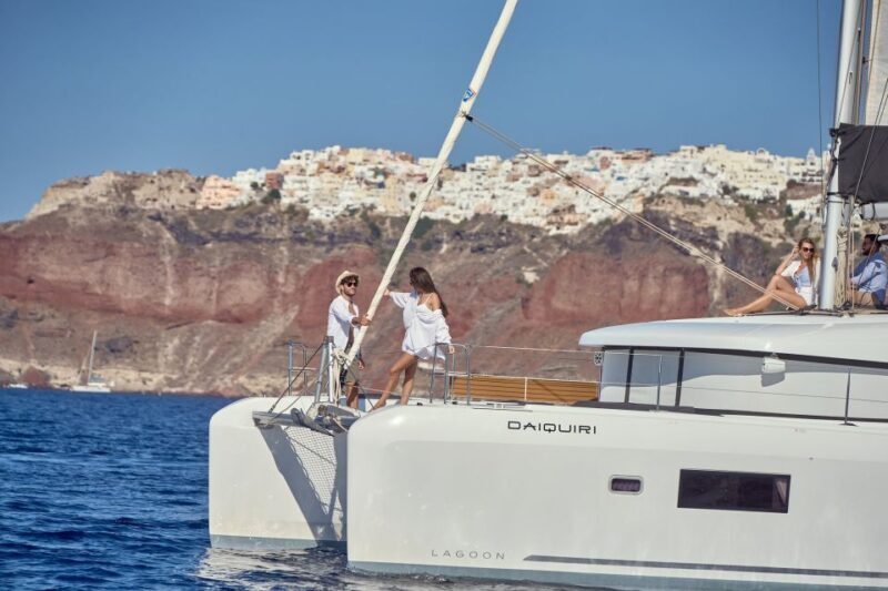 Santorini: Day Luxury Catamaran Cruise with Meal & Drinks - Key Points