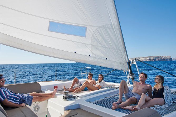 Santorini Gold Catamaran Cruise with BBQ, Drinks and Hotel Pickup - The Sum Up