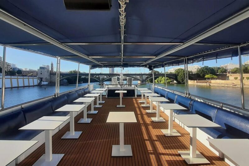 Seville: Restaurant boat ride on the Guadalquivir River with lunch/dinner - Navigating the River: What to Expect on the Cruise