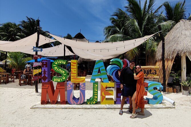 Top Isla Mujeres Catamaran Tour with Snorkel Open Bar and Buffet lunch - The Sum Up