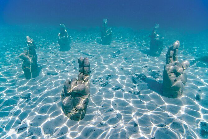 Trip to Isla Mujeres by Catamaran, with snorkeling and drinks - Who Should Consider This Tour?