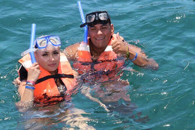 Unforgettable Catamaran Cruise from Cancun to Isla Mujeres - Sunset Return and Celebration